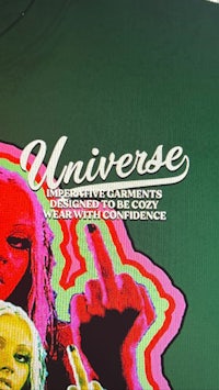 a green t - shirt with the words universe on it